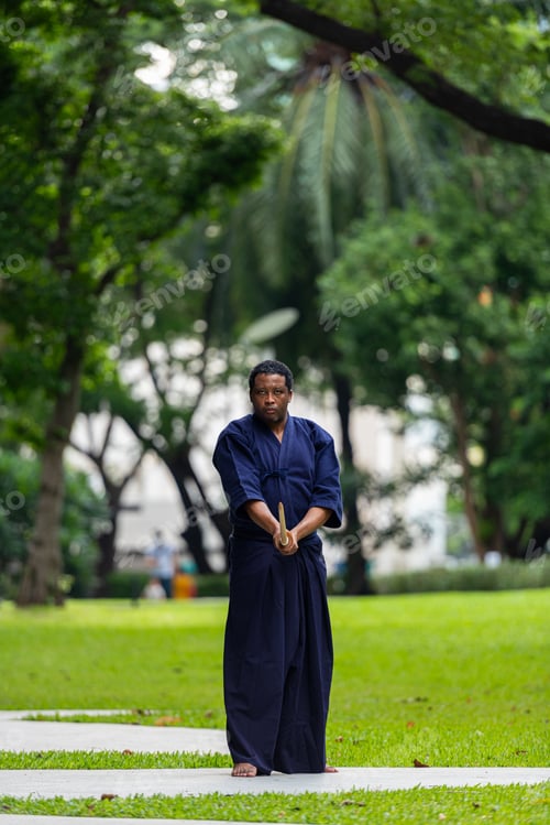 Preview: Handsome black martial artist man with martial arts costume of kendo
