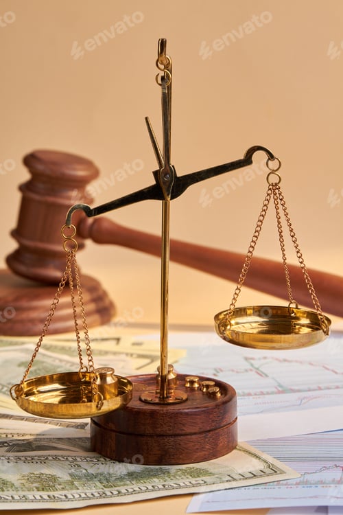 Preview: Close-up scales and wooden judge gavel hammer.