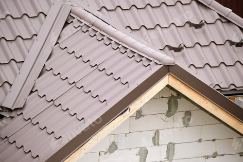 Preview: Closeup of house roof top covered with metallic shingles