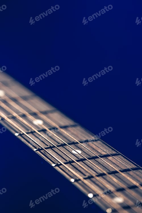 Preview: Part of an acoustic guitar, guitar fretboard on a black background.