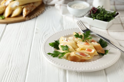 Preview: Concept of tasty food, thin pancakes with filling, space for text