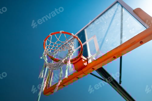 Preview: Basketball hoop close up outdoors. Blue sky on background