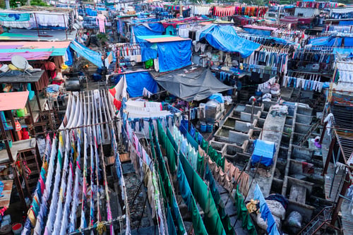 Preview: Dhobi Ghat is an open air laundromat lavoir in Mumbai, India with laundry drying on ropes