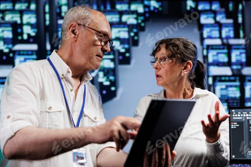 Preview: Elderly servicemen doing server analysis
