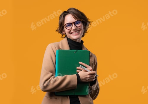 Preview: Smiling Woman Holding Green Folder on Orange Background