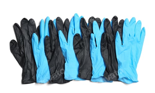 Preview: Different medical gloves on white background, top view