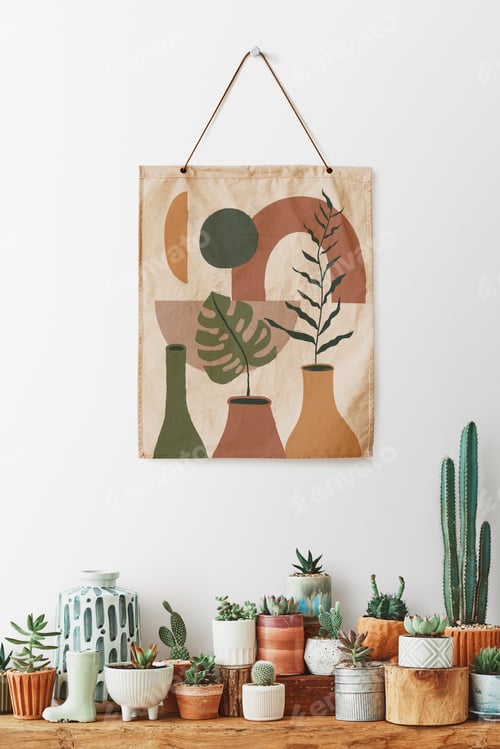 Preview: Painting hanging over a shelf full of cacti and succulents