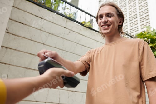 Preview: Man Paying for Pizza Delivery