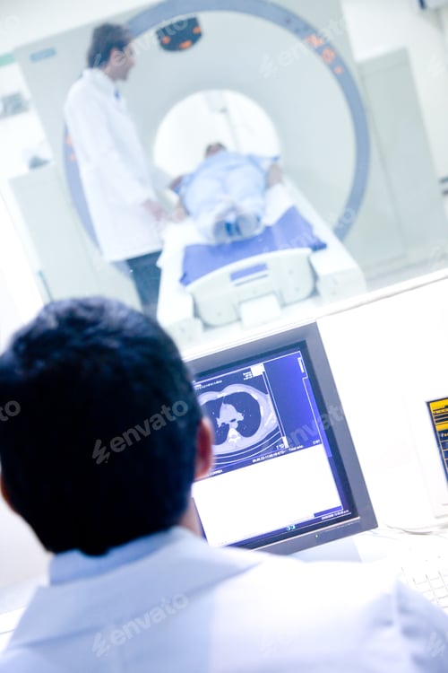 Preview: Couple Of Doctors Performing A Medical Scan To A Patient