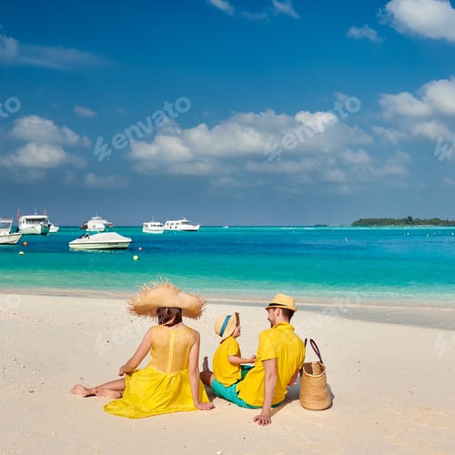 Preview: Family On Beach, Young Couple In Yellow With Three Year Old Boy. Summer Vacation At Maldives.