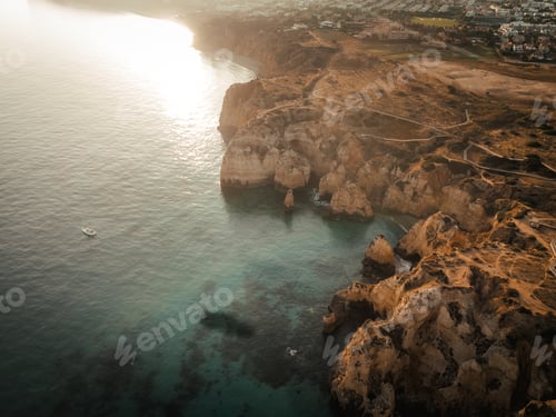 Preview: Aerial Drone view of Ponta da Piedade during sunset in Lagos Algarve, Portugal