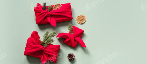 Preview: Christmas Presents Wrapped in Fabric.