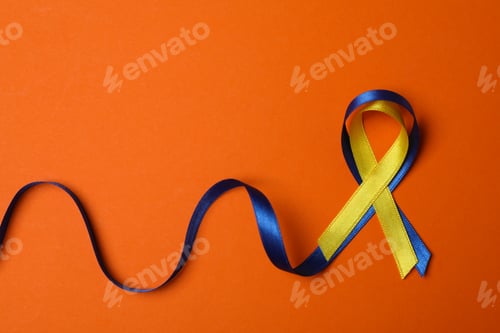 Preview: Down Syndrome awareness ribbons on orange background