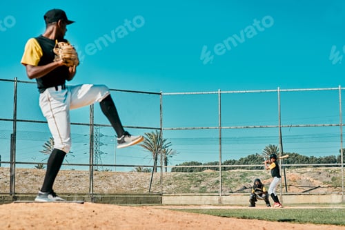 Preview: Shot of a young baseball player getting ready to pitch the ball during a game outdoors