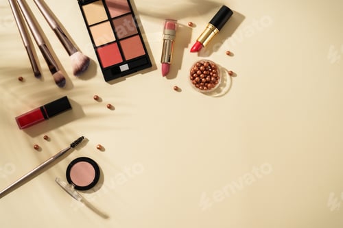 Preview: Make up products at colored background with hard shadows.