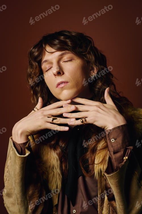 Preview: Stylish young man posing gracefully with a confident expression and elegant accessories