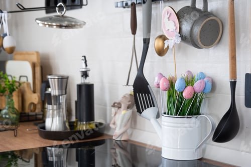 Preview: Interior of kitchen and details of decor of utensils with Easter decoration of colorful eggs in a lo
