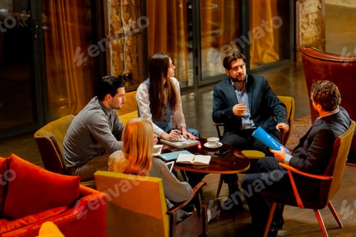 Preview: top shot in large beautiful hall office employees sitting on yellow chairs discuss a deal