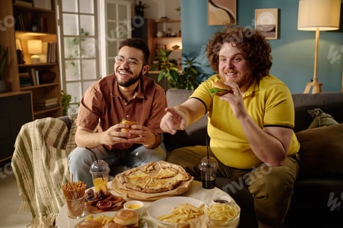 Preview: Enjoying Pizza and Snacks in Cozy Living Room Setting