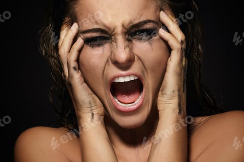 Preview: Beautiful woman with smudged makeup on her face