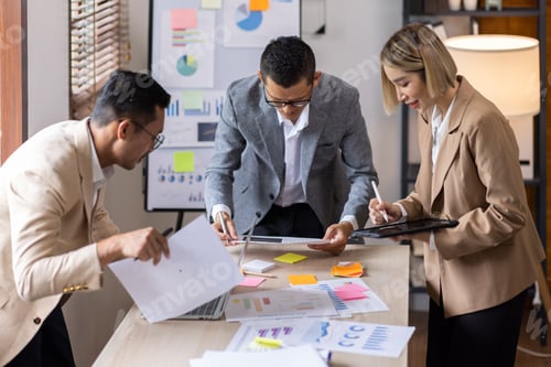 Preview: Group of confident business people point to graphs and charts to analyze market data, balance sheet,