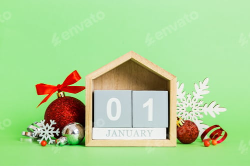 Preview: 1 january. Christmas composition on colored background with a wooden calendar