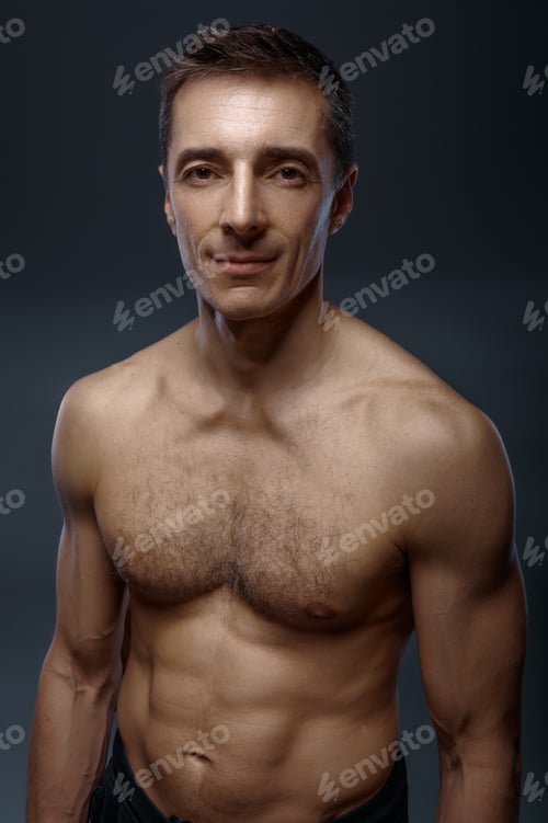 Preview: Male yoga with muscular body on grey background