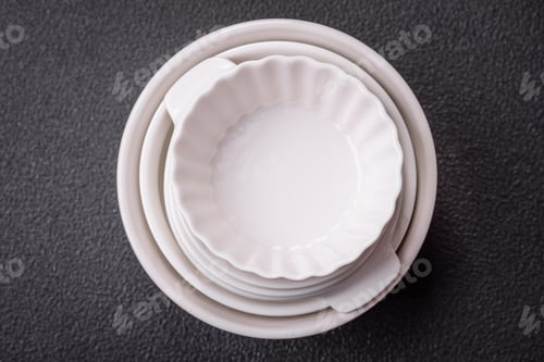 Preview: Beautiful empty white ceramic gravy boat on a textured concrete background
