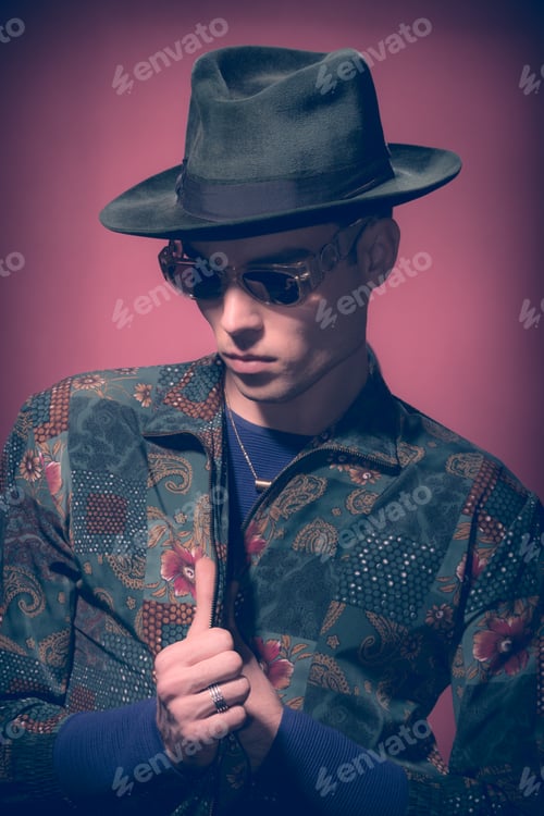 Preview: One Young Adult Man Model, Looking Down, Hat, Fashion Photography, Studio, Red Background