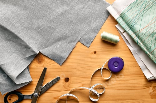 Preview: Pattern paper,linen fabric,scissors,sewing machine and others sewing accessories in fashion atelier