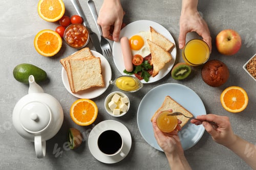 Preview: Delicious breakfast or lunch background. Grey table. People eat