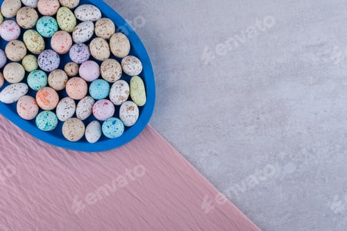 Preview: Colorful stone candies on a piece of tablecloth
