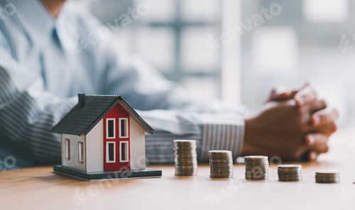 Preview: stack of money and home models, home insurance ideas and insurance agents for those interested.