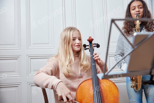 Preview: Two girls playing cello and saxophone together