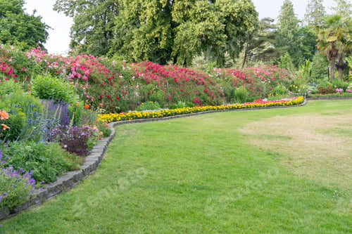 Preview: A View Of A Lawn And Flower Garden At Point Defiance Park In Tacoma, Washington.