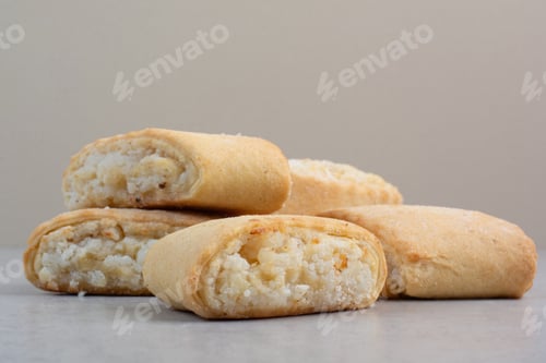 Preview: Tasty stuffed biscuits on gray table