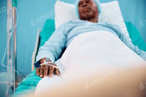 Preview: Close up of senior black patient recovering in hospital ward.
