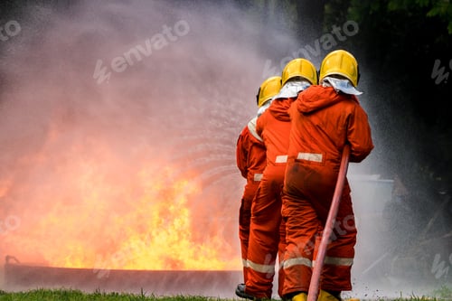 Preview: Firefighter Concept. Fireman using water and extinguisher to fighting with fire flame.