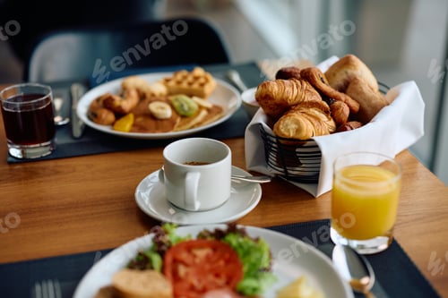 Preview: Close up of dining table during breakfast in a hotel.