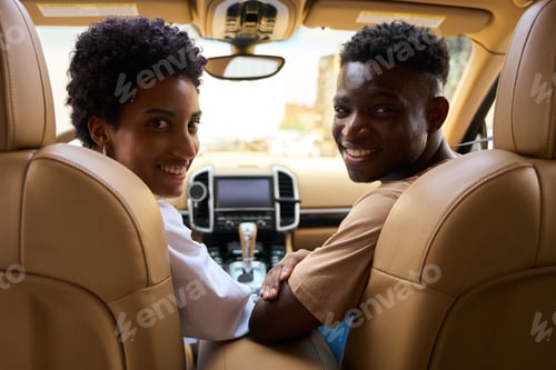 Preview: Smiling Man and Woman Ride in Car