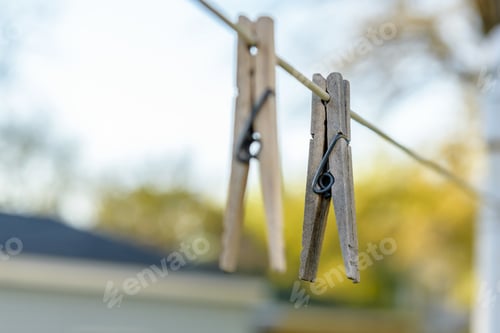 Preview: Macro close up of wooden clothespins on line