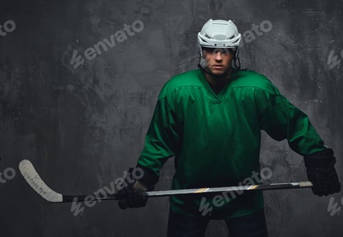 Preview: Hockey player wearing black protective uniform holds a hockey stick on a gray background.