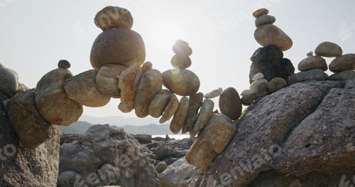 Preview: Arch of pebbles in balancing on the sea coast