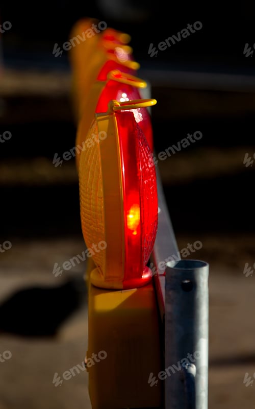 Preview: Closeup of yellow and red warning lights seen from the side