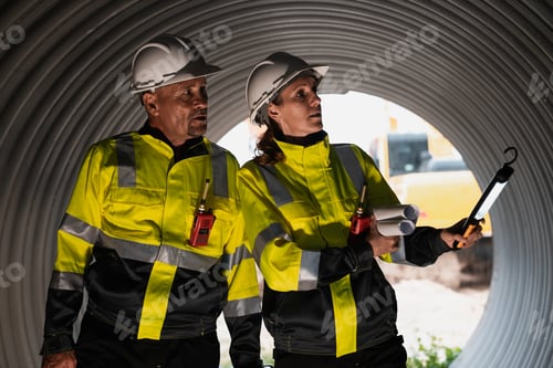 Preview: Engineers working inside a steel pipe, building a pipeline for oil, gas, and fuel transport.
