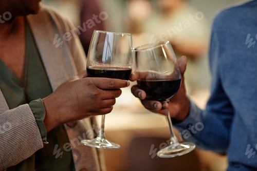 Preview: Couple Holding Wine Glasses
