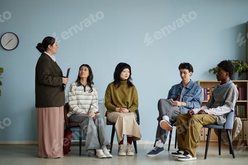 Preview: Diverse Teenagers Attending Counseling Session with Female Counselor Indoors