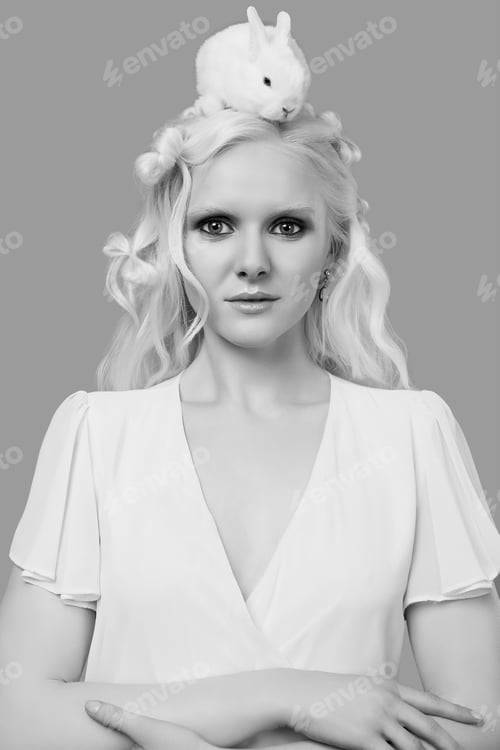 Preview: Fashion Portrait Of Albino Blond Girl With White Skin And Blue Eyes In Elegant Dress Posing With