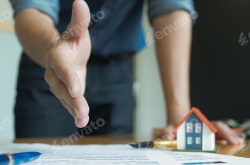 Preview: House sales staff extended their hands in front. Join hands with customers to close sales.