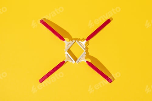 Preview: Studio shot of disposable razor tools on yellow